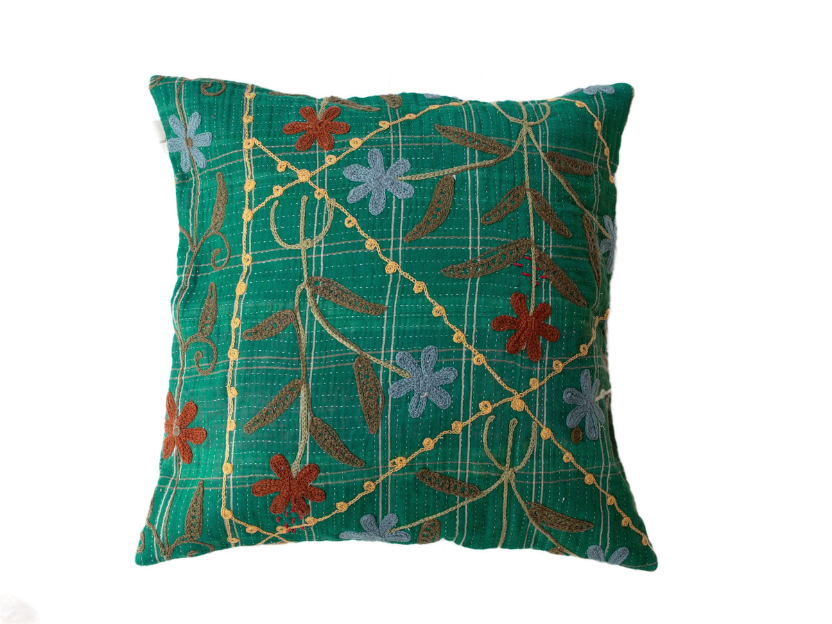 Green suzani pillowcase 50x50 cm in boho-oriental style with checkered stripe pattern and colorful embroidered flowers in brown, red and light blue.